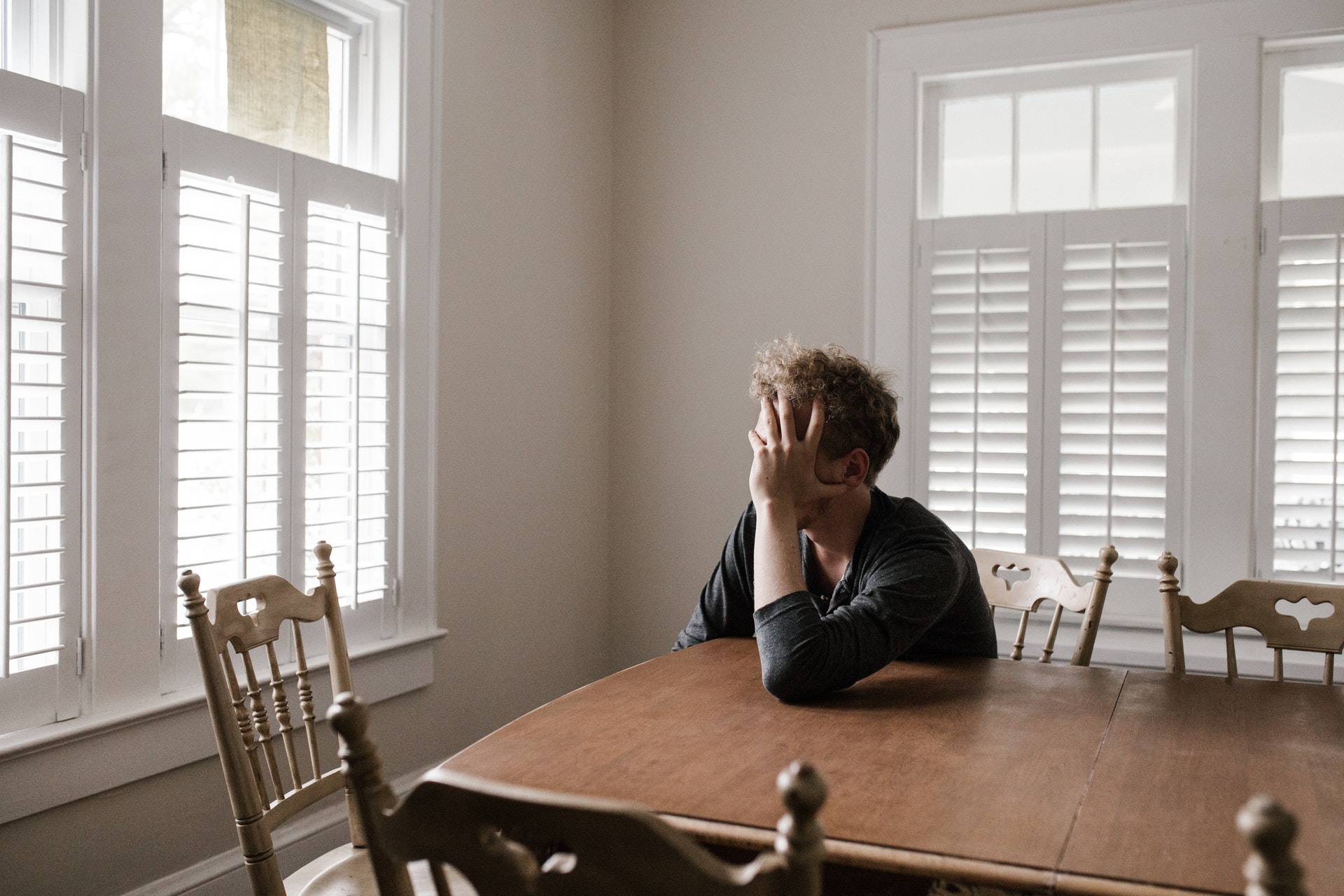 Man leaning on table